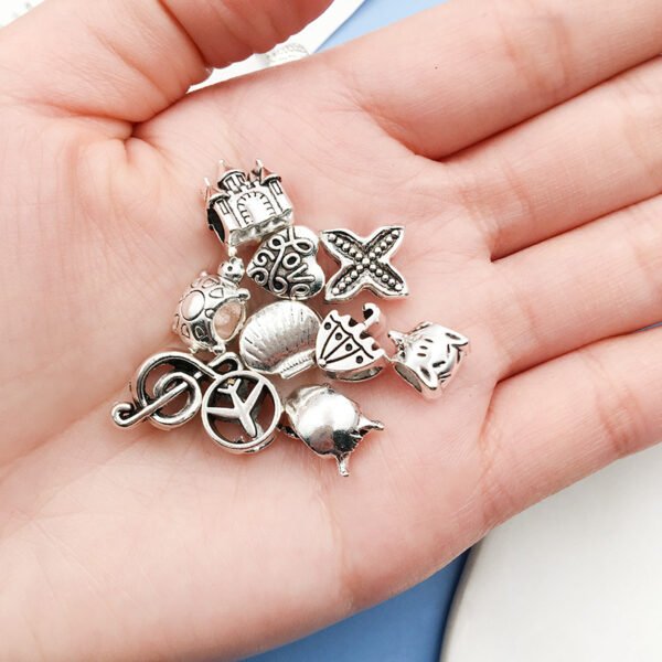 Silver-colored double-winged heart-shaped aircraft umbrella-shaped musical notes turtle with large holes, pearl string and pearl accessories, alloy small pendant. - Image 6