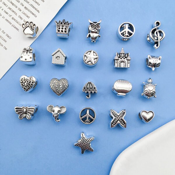 Silver-colored double-winged heart-shaped aircraft umbrella-shaped musical notes turtle with large holes, pearl string and pearl accessories, alloy small pendant. - Image 3