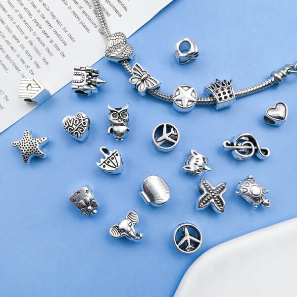 Silver-colored double-winged heart-shaped aircraft umbrella-shaped musical notes turtle with large holes, pearl string and pearl accessories, alloy small pendant. - Image 2